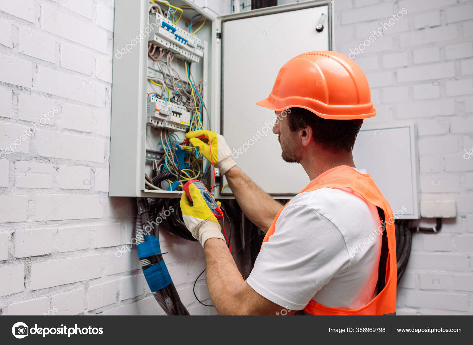 Handsome Electrician Hardhat Gloves Holding Multimeter Electrical