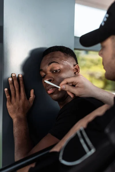 Selective Focus Police Officer Holding Joint African American Man — Stock Photo, Image