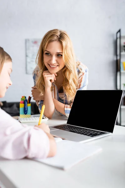 Selective Focus Smiling Woman Looking Kid Writing Copybook Laptop Blank — Stock Photo, Image