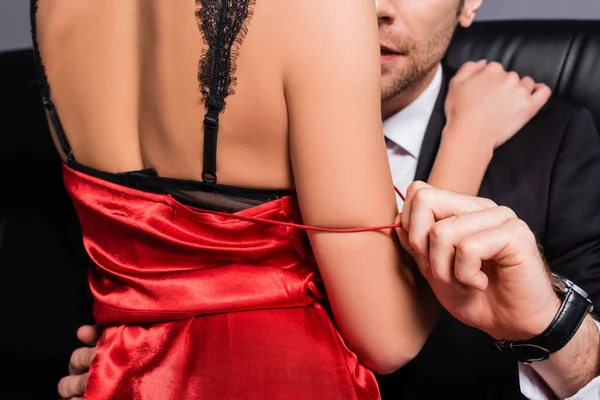 Cropped View Man Taking Red Dress Girlfriend Lace Bra Couch — Stock Photo, Image