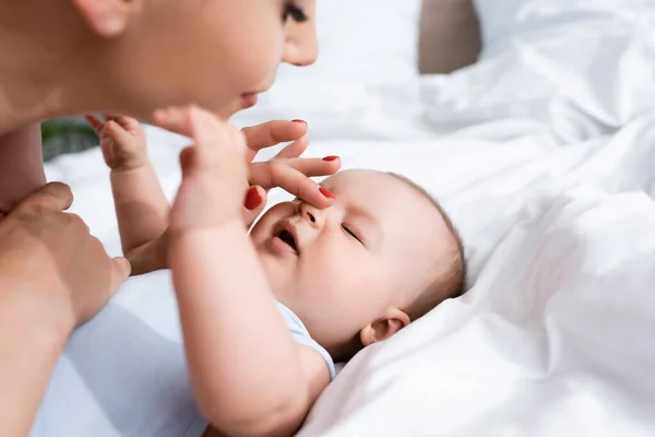 Selective Focus Mother Touching Nose Cute Baby Boy Bed — Stock Photo, Image