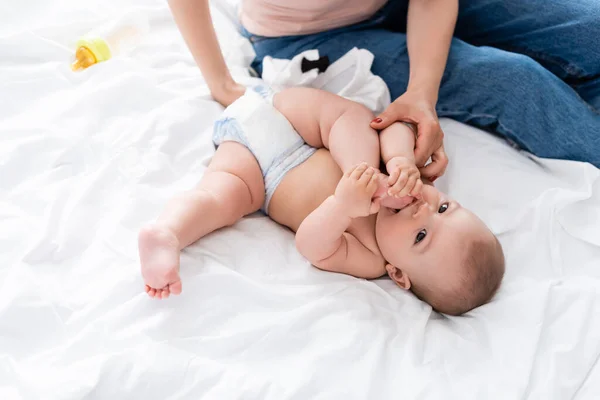 Mother Sitting Bed Touching Cute Infant Son Diaper — Stock Photo, Image