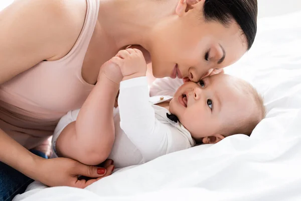 Attractive Mother Closed Eyes Cute Infant Son Bed — Stock Photo, Image