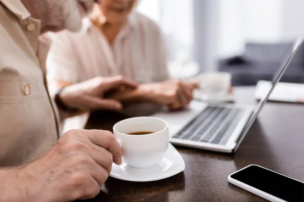 Cropped View Senior Man Holding Cup Coffee Digital Devices Wife — Stock Photo, Image
