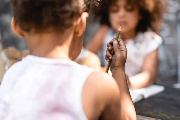 Selective Focus Poor African American Kid Holding Pencil Sister — Stock Photo, Image