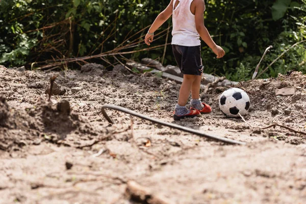 Cropped View Destitute African American Child Playing Football Dirty Road — Stock Photo, Image
