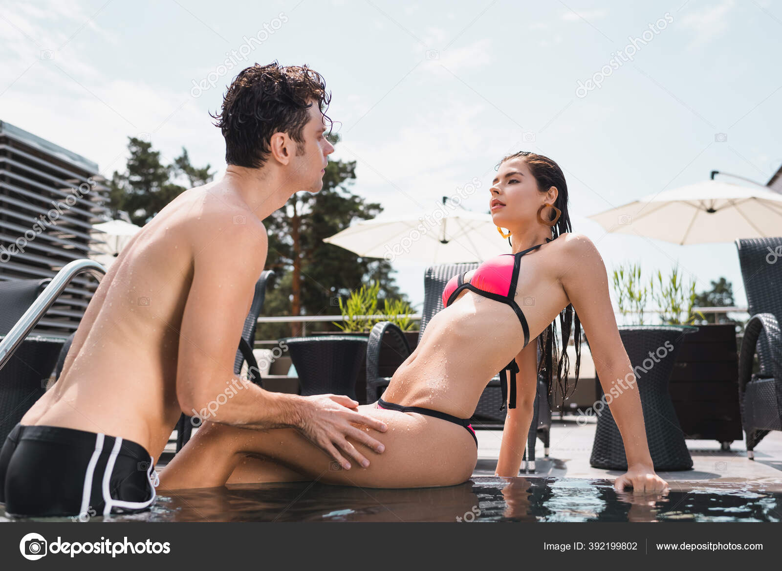Shirtless Man Touching Wet Woman Swimwear Sitting Pool Stock Photo