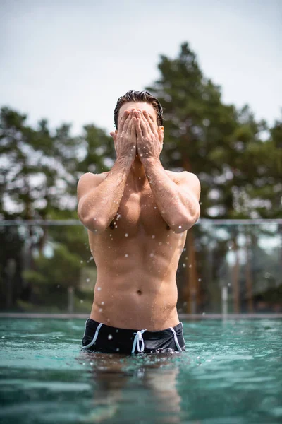 Selective Focus Shirtless Wet Man Standing Covering Face Swimming Pool — Stock Photo, Image