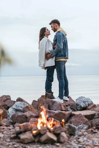 Selective Focus Handsome Man Hugging Girl While Standing River Bonfire — Stock Photo, Image