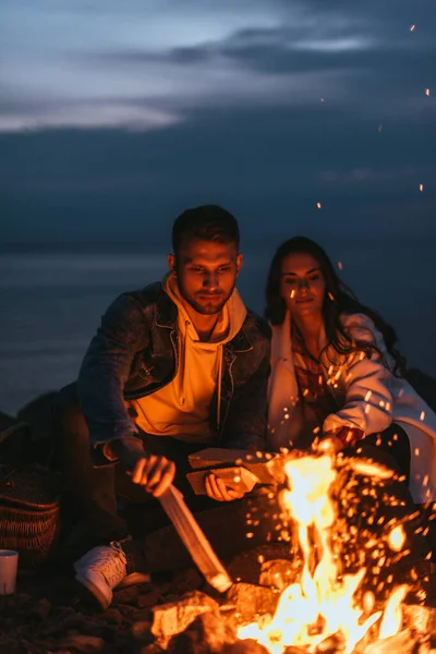 Selective Focus Handsome Man Putting Log Bonfire Girl — Stock Photo, Image