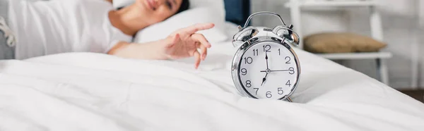 Horizontal Crop Alarm Clock Smiling Asian Woman Pulling Hand Bed — Stock Photo, Image