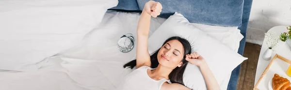 Panoramic Shot Asian Girl Stretching Alarm Clock Breakfast Bedside Table — Stock Photo, Image