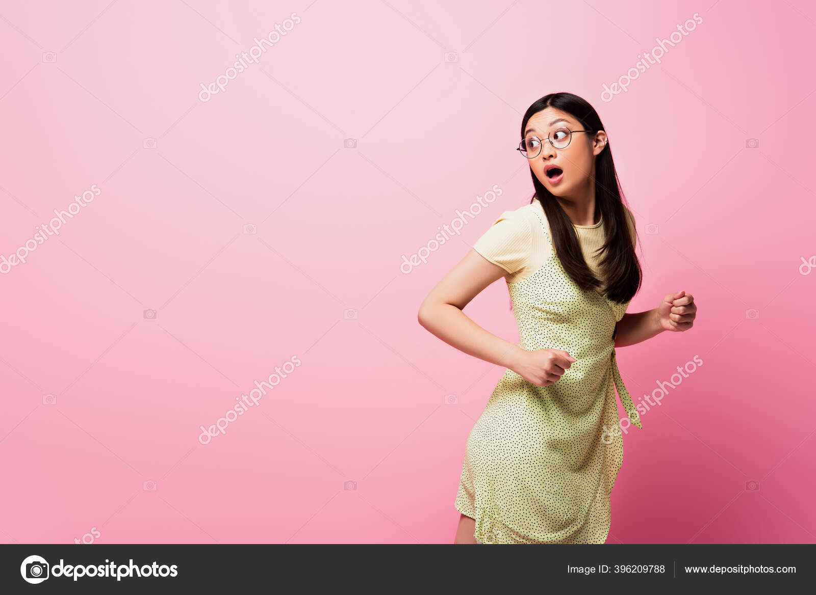 Shocked Asian Woman Glasses Running Looking Away Pink Stock Photo by