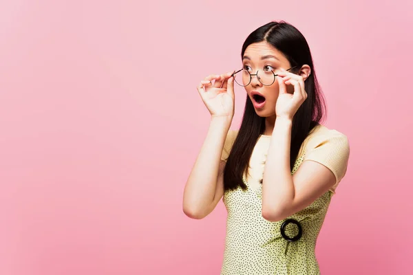 Shocked Asian Girl Open Mouth Looking Away Touching Glasses Isolated — Stock Photo, Image