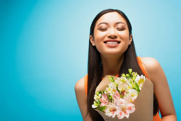 Happy Asian Girl Closed Eyes Smiling Holding Flowers Blue — Stock Photo, Image