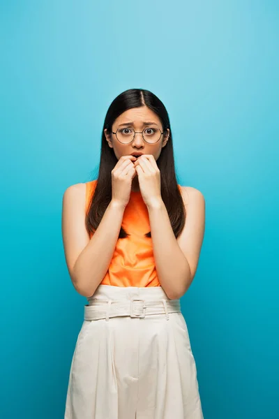 Young Scared Asian Woman Touching Mouth Blue — Stock Photo, Image