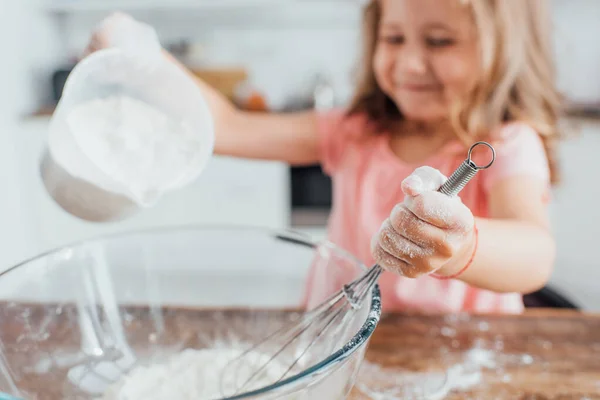 Selective Focus Girl Pouring Flour Glass Bowl While Holding Whisk — Stock Photo, Image