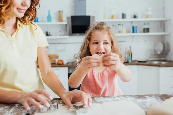 Cropped View Woman Cutting Dough Molds While Daughter Holding Raw — Stock Photo, Image