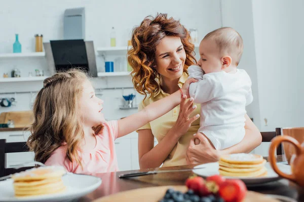 Selective Focus Young Mother Infant Boy Daughter Sitting Table Served — Stock Photo, Image