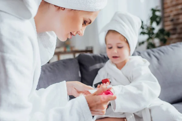 Selective Focus Young Woman Making Manicure Daughter While Sitting Together — Stock Photo, Image