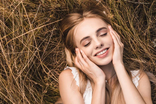 Top View Blonde Woman Touching Face While Lying Green Grass — Stock Photo, Image