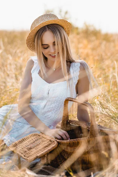 Blonde Woman White Dress Straw Hat Sitting Wicker Basket Field — Stock Photo, Image