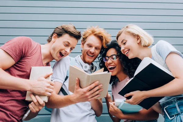 Low Angle View Excited Multicultural Students Reading Book Urban Street — Stock Photo, Image