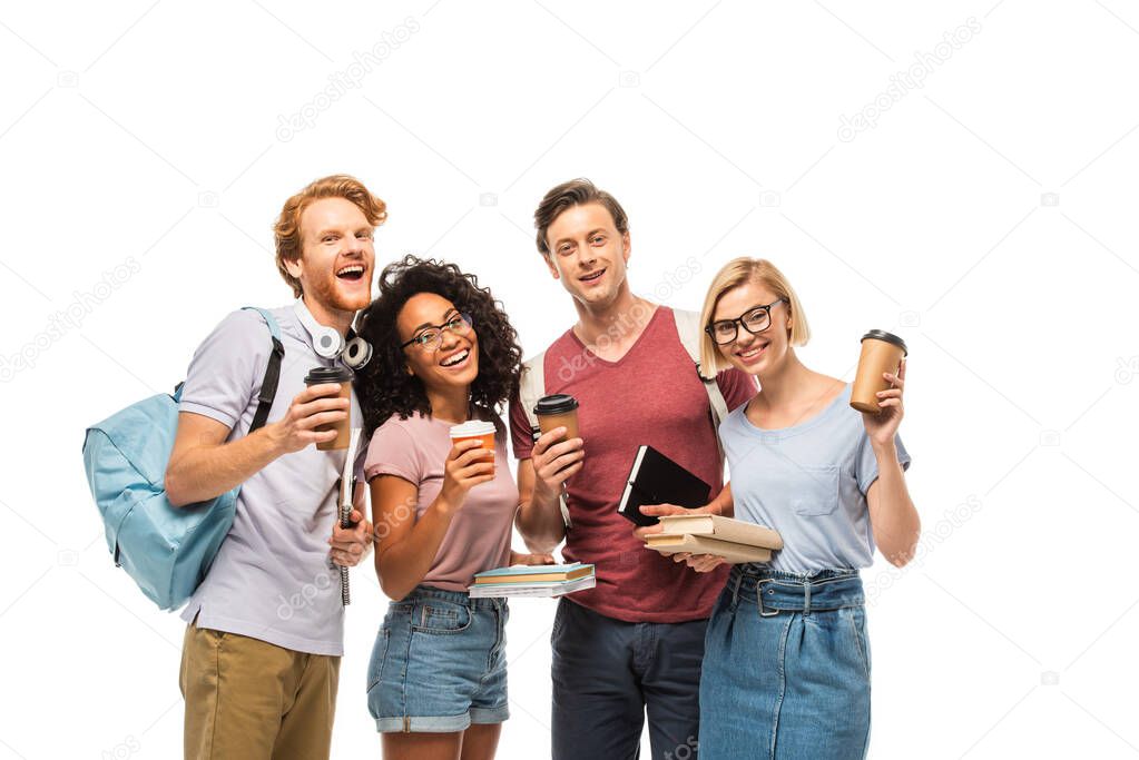 Multicultural students with books and coffee to go looking at camera isolated on white