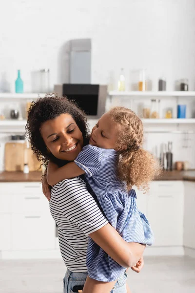 Young African American Woman Closed Eyes Holding Daughter Hands Kitchen — Stock Photo, Image
