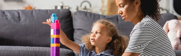 Panoramic Concept African American Girl Building Tower Multicolored Blocks Nanny — Stock Photo, Image