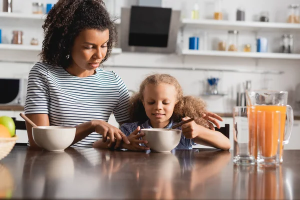 Young African American Mother Striped Shirt Touching Hand Daughter Breakfast — Stock Photo, Image