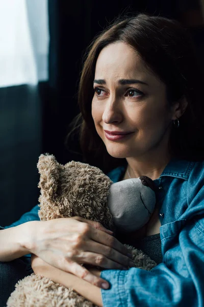Upset Brunette Woman Holding Teddy Bear Looking Away — Stock Photo, Image