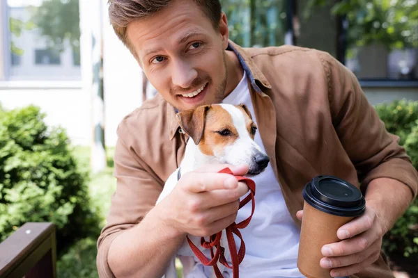 Young Man Jack Russell Terrier Dog Holding Paper Cup Pointing — Stock Photo, Image