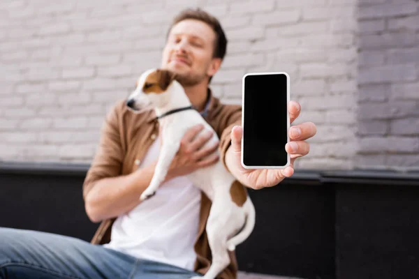 Selective Focus Young Man Holding Cellphone Blank Screen Jack Russell — Stock Photo, Image