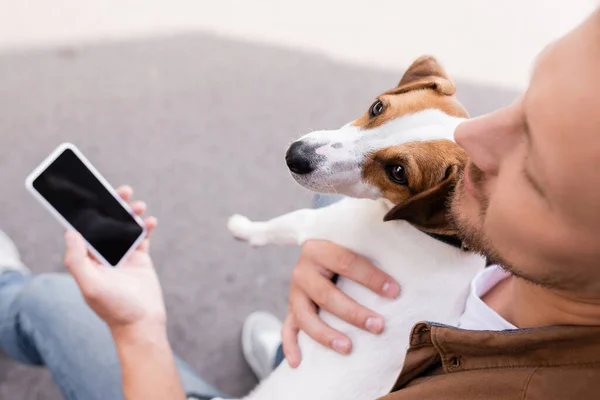 Selective Focus Man Embracing Jack Russell Terrier Holding Smartphone Blank — Stock Photo, Image