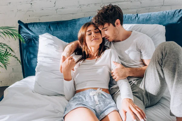 Young Woman Touching Boyfriend Pajamas Bed Morning — Stock Photo, Image