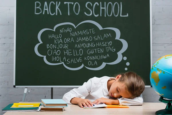 Exhausted Schoolgirl Sleeping Desk Globe Chalkboard Back School Greeting Lettering — Stock Photo, Image