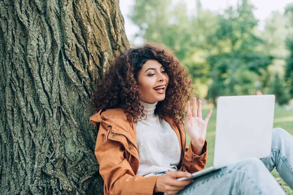 Selective Focus Woman Raincoat Having Video Call Laptop Park — Stock Photo, Image