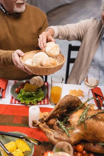 Cropped View Woman Taking Bun Senior Husband — Stock Photo, Image