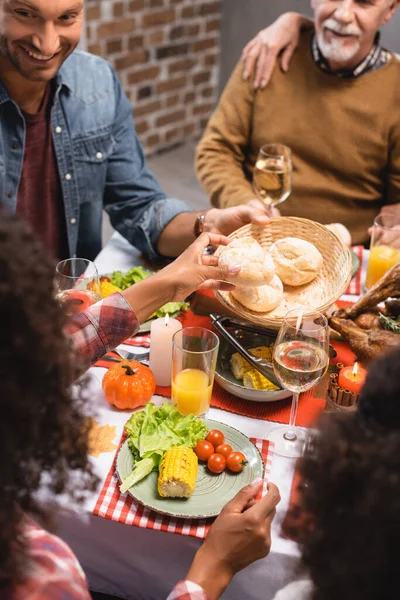 Selective Focus Man Looking African American Woman Holding Bun Thanksgiving — Stock Photo, Image