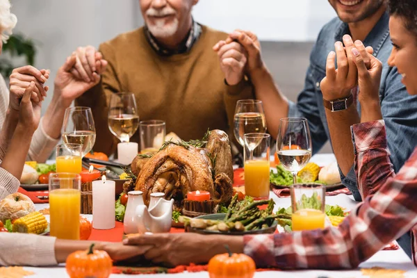 Cropped View Pleased Multiethnic Family Holding Hands Thanksgiving — Stock Photo, Image