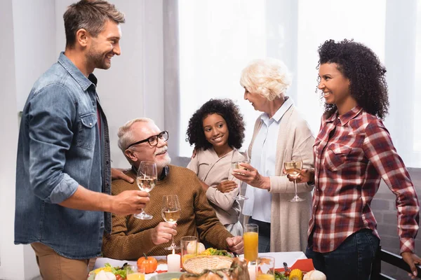 Excited Multiethnic Family Talking While Holding Wine Glasses Table Served — Stock Photo, Image