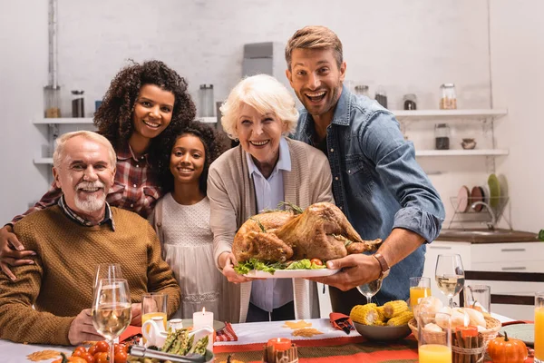 Selective Focus Multiethnic Family Holding Turkey Looking Camera Thanksgiving — Stock Photo, Image