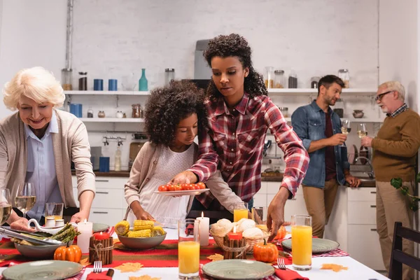 Selective Focus Multiethnic Women Putting Food Table African American Girl — Stock Photo, Image