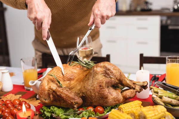 Cropped View Senior Man Cutting Turkey Candles Thanksgiving Dinner — Stock Photo, Image