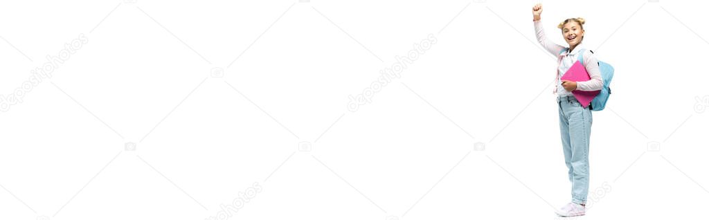 Panoramic orientation of schoolgirl with laptop and backpack showing yeah gesture on white background