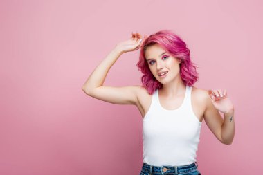 young woman with colorful hair posing isolated on pink clipart