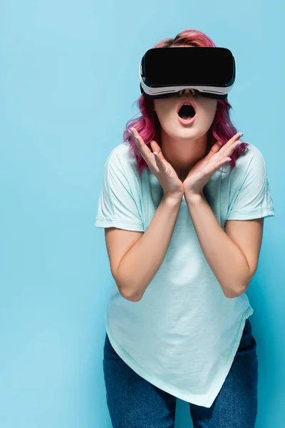 Shocked Young Woman Pink Hair Headset Holding Hands Face Blue — Stock Photo, Image