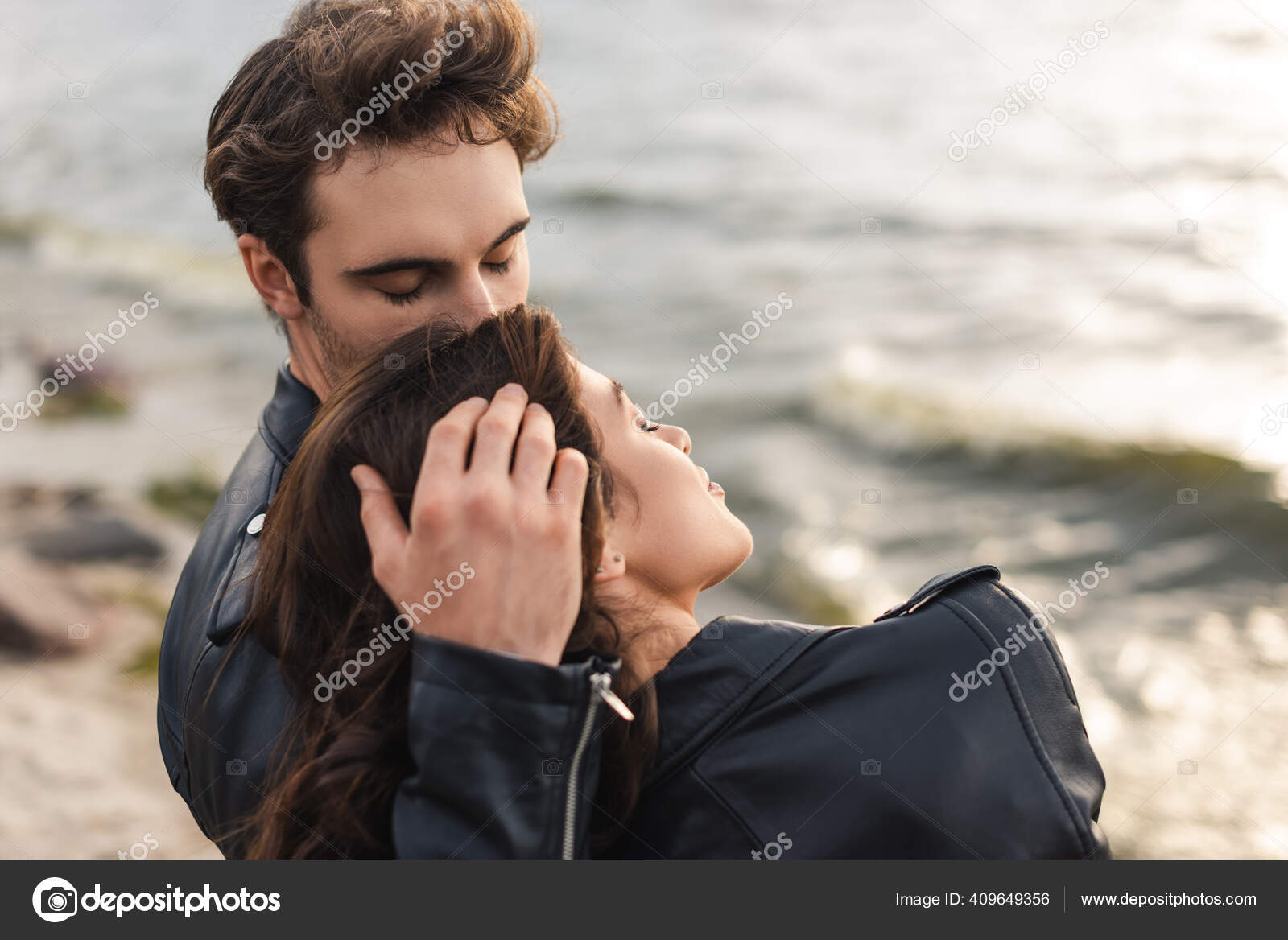 Man Kissing Touching Hair Woman Leather Jacket Beach Stock Photo by  ©HayDmitriy 409649356