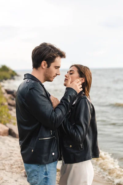 Side View Young Man Touching Brunette Girlfriend Leather Jacket Seaside — Stock Photo, Image